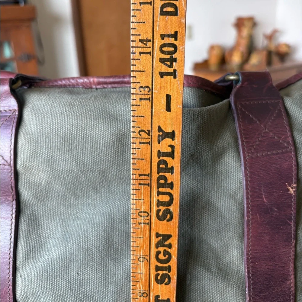 Vintage Eddie Bauer, green canvas w/leather trim handles/bottom top snap closure